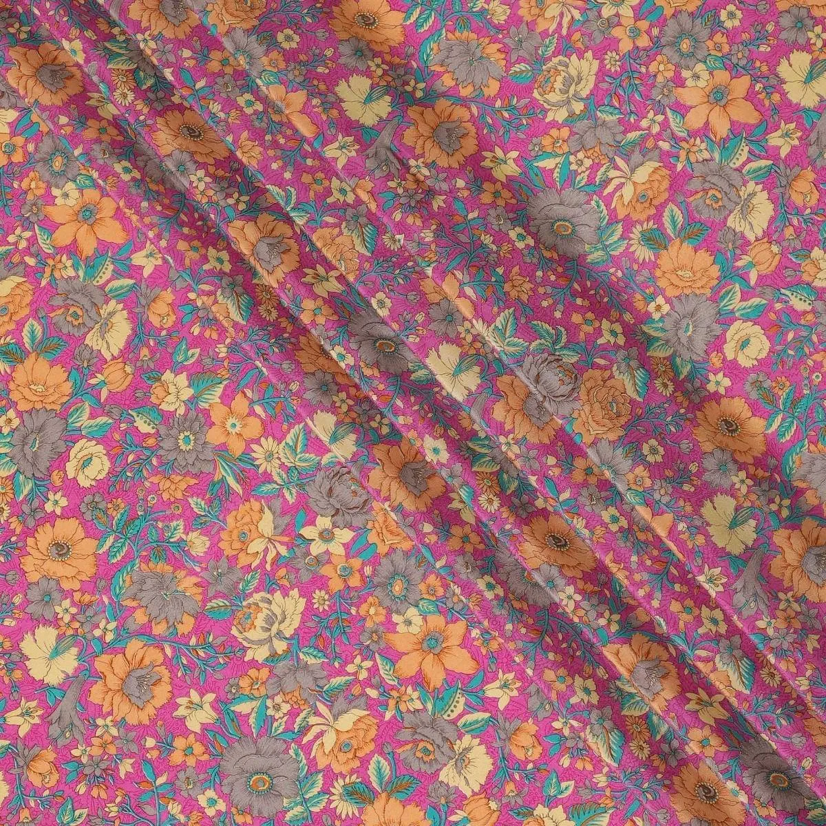 Magenta pink silk crepe fabric with light orange, blue and cream prints in floral design - D9908